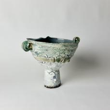 Wheel-thrown and altered stoneware and porcelain ceramic with slips and glazes.