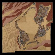 appliqued and quilted aeriel view and a trash dump in the desert.