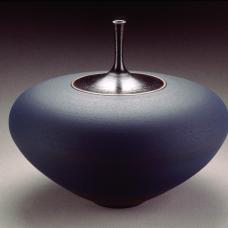 Thrown  terracotta vase. Black neck is shiny and the lower part of the vase is blue and matte.