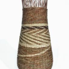 Rattan basket with the white, brown and gold tones creating a zig zap center band.