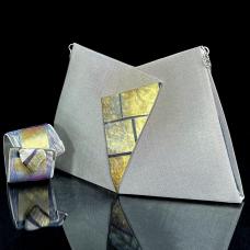 Evening purse made of stainless steel mesh decorated with 23 karat gold leaf