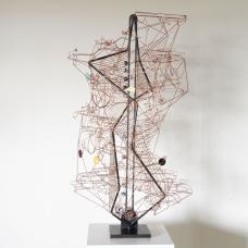 Copper wire and steel kinetic sculpture. Glass marbles (Handcrafted by Aaron Slater) are lifted to the top of the sculpture and roll down four possible paths interacting with eight kinetic elements. Kiln-fired  enamelled copper parts function as counterweights to moving elements.