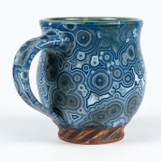 Blue mug with crystalline glaze body and base made to look like wood