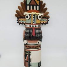 Carved from cottonwood root  painted with natural earth pigment paints. Other materials used  horse hair  yaccu plant and partridge tail feathers