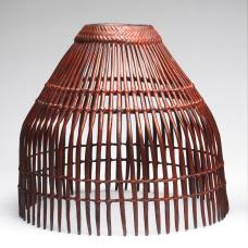 Cast bronze cage-like basket with sulfur patina and red pigment