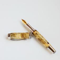 A fountain pen made of reclaimed wood from California.
