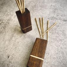 Forged brass cocktail picks with walnut and brass holder.