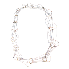 Graduated cones of interlocking nylon-coated steel finished with 14k gold fill tubing. The neckpiece is soft and pliable  conforming to the body when worn.