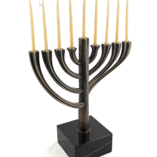 This stunning menorah was designed on the computer using CAD software. The model was 3D printed and then cast in bronze. The piece has a solid marble base. It is a limited edition of 8. Each is numbered and dated.