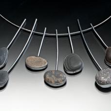 hand fabricsted necklace of sterling silver and rocks