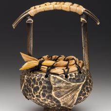 Cast bronze basket from coiled and woven sweet grass