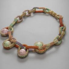 Necklace with magnetic closure part of the collection Pods. handwoven with fine 24K gold plated and Toho duracoat seed beads. Vintage marbled lucite spheres are nestled in the bead mesh in place of gems. Ongoing collection  limited edition available in various color combinations.