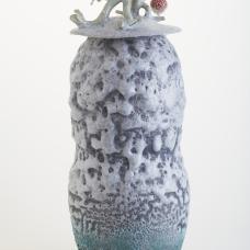 porcelain vase with lid and glaze with laza rock effect.