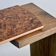 Detail- Havana series console table. The base is made of walnut with a top featuring a walnut burl veneer in an Asian cracked ice pattern.