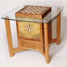 The innovative design of this piece allows it to be used as an end table  but it functions as a game table. Lift and turn the cube to play chess  checkers  backgammon  or Scrabble. Game pieces stow neatly in the drawer beneath. (mahogany  holly  laurel burl  glass)