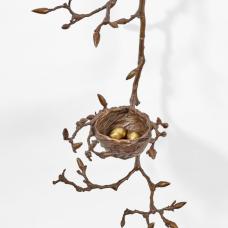Cast bronze sculpture with a nest and eggs resting on a cascading Magnolia branch and luminescent antique brown patina.