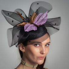 This cocktail hat has 3 parts to it. First  the base I made from 11 mm Swiss tubular braid  edged with horsehair and single strand of Paglina braid. The mid section is 14 inch horsehair with chenille dots which I gathered and layered. The dragonfly I put together with bias cut squares of synamy fiber  pleated them  for the wings Wire  bead and feathers for accents.