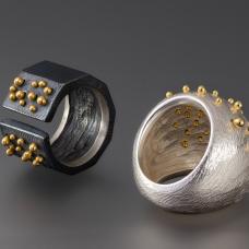 carved sterling silver rings pinned through with 18k gold balls