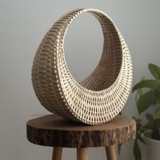 Cresent-shaped basket with light wood weave