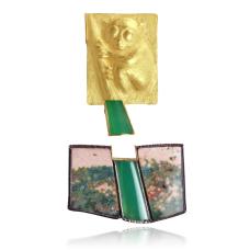 This endangered species is the top part of my 2 part brooch. The gold tarsier is holding onto a branch of chrysoprase  which I cut. The bottom is an environment of ocean jasper  set in silver  that has chrosoprase set in gold lower in between to represent a broken environment