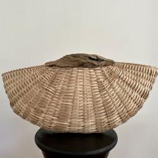 Hald-circle shaped basket with light wood weave and dark driftwood rim