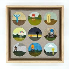 appliqued and quilted fabric depicting nine watertowers framed by circles