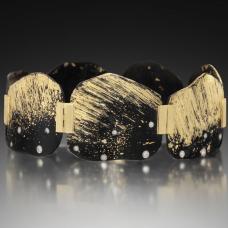 Formed and fabricated iron hinged cuff bracelet with fused surface accents of 22K Yellow Gold  seven 18K Yellow Gold hinges  and a box lock clasp. Diamonds are flush set in 18k Palladium White Gold bezels.