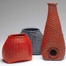 Three Cast bronze baskets with red and blue patinas.
