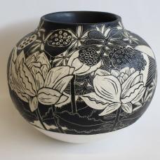 The images on the surface of the pot were created using sgraffito and depict a pond that includes flowers  insects  and birds. The lower portion of the pot is glazed with satin white glaze.