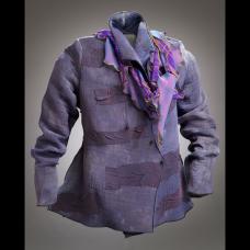 Silk that has been dyed purple. Applique that has been added as a design. The silk has been dyed the same purple. The scarf is dyed purple.