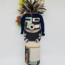 Carved from cottonwood root  painted with natural earth pigment paints. Other materials used  duck  parrot feathers  cornhusk and natural dyed yarn.