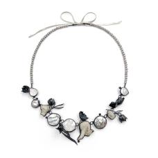 Bullae bones  baroque pearls  black diamonds  grey pearls  silver  satin. Cast marigolds. Cast and fabricated.