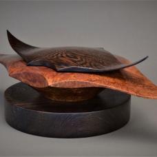 Large Red Morrel Burl hollowed out Manta Ray Box with Wenge Manta Ray Lid. Innovatively sculpted on the lathe at over 2000 rpm. The large round Wenge pedestal base is included.